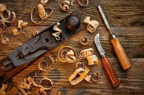 free woodworking plans for beginners Woodworking hand tools and beginner project plans laid out on a workbench